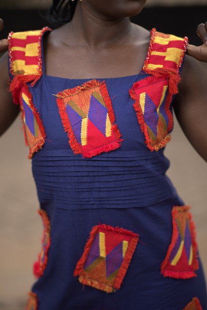 Young woman in kente dress