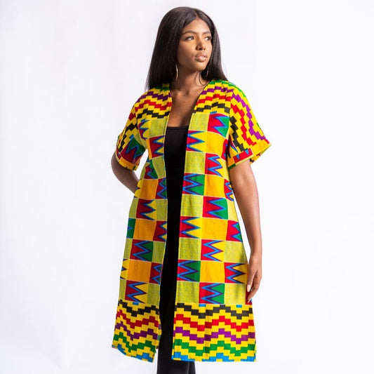 Young woman in African print kente kimono