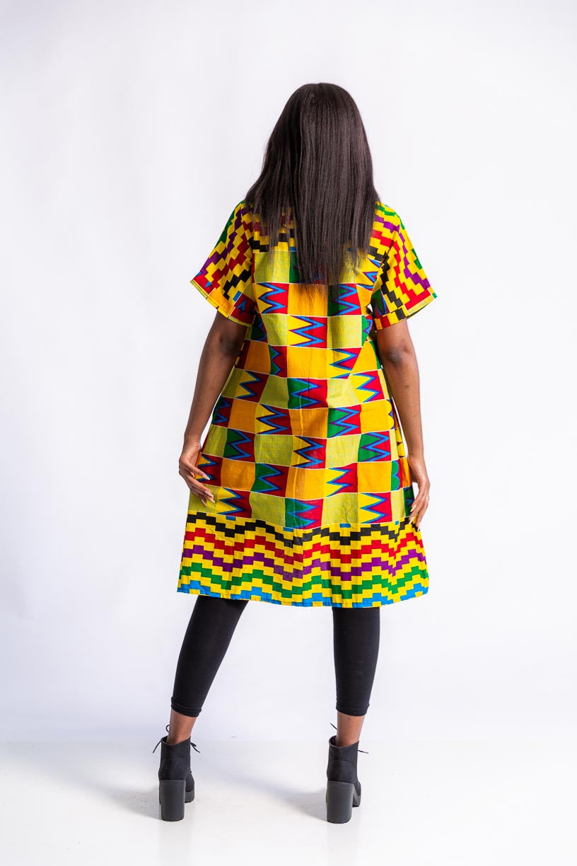 Young woman in African print kente kimono