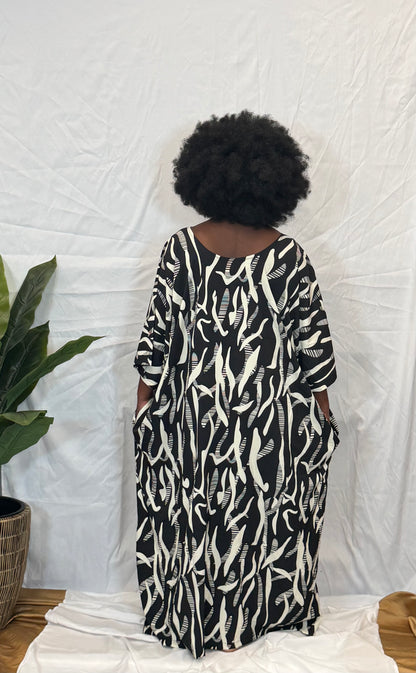 Black woman wearing bright colorful kaftan