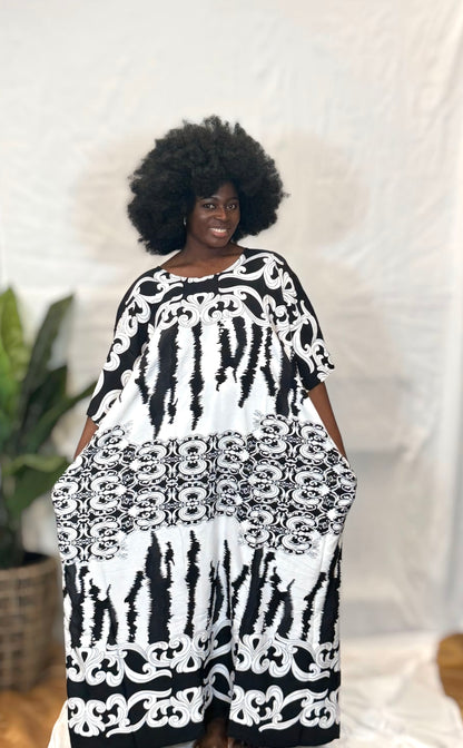 Black woman wearing bright colorful kaftan