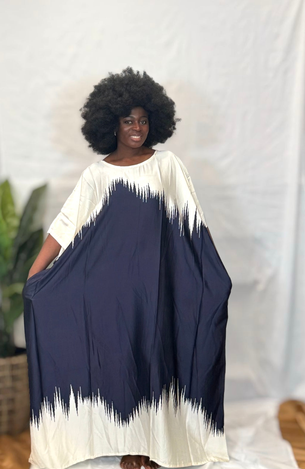 Black woman wearing bright colorful kaftan