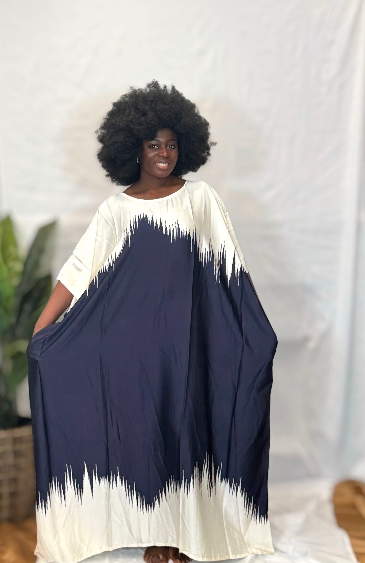 Black woman wearing bright colorful kaftan