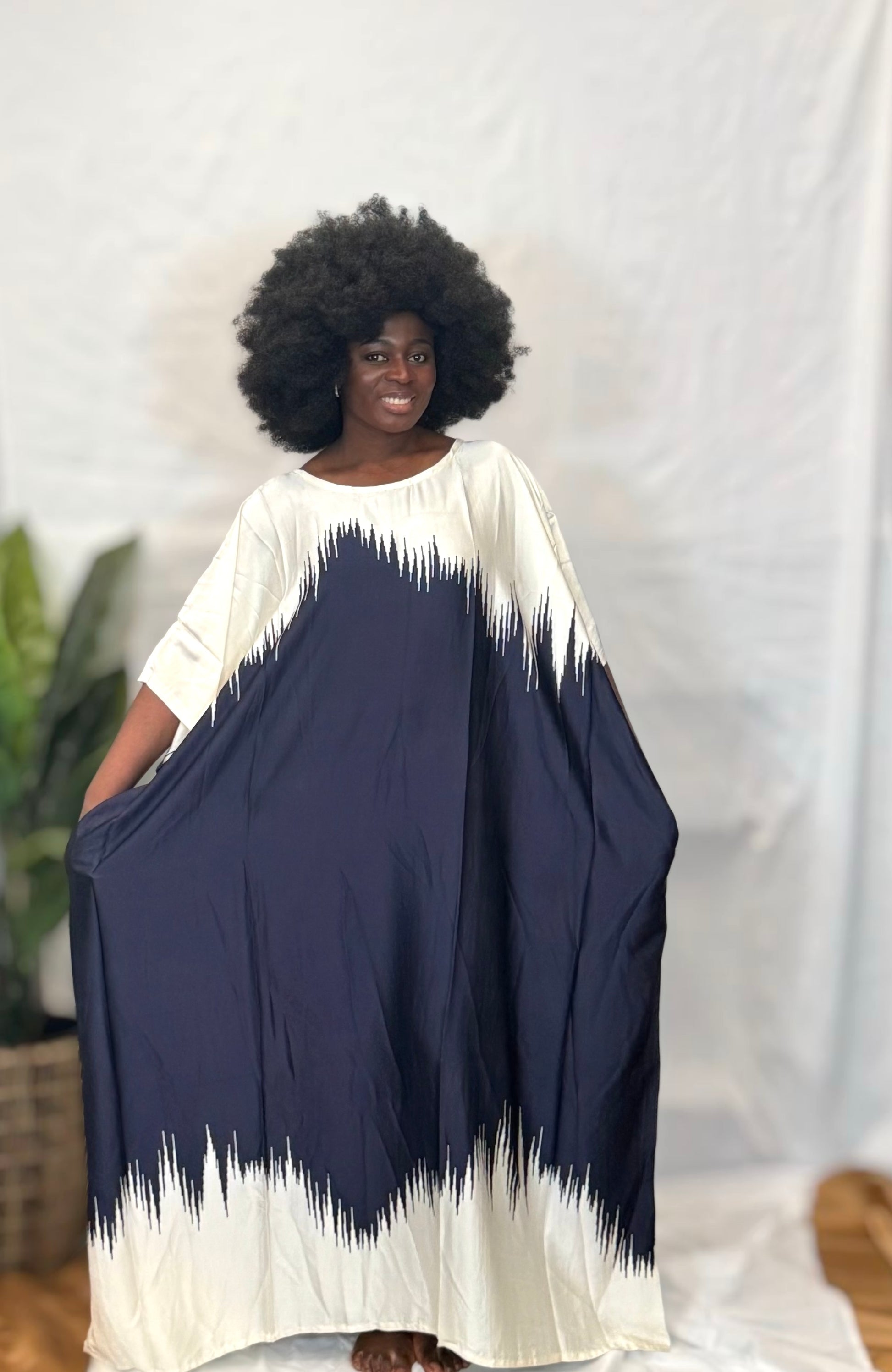 Black woman wearing bright colorful kaftan