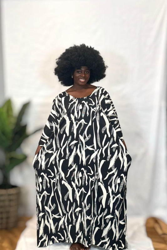 Black woman wearing bright colorful kaftan