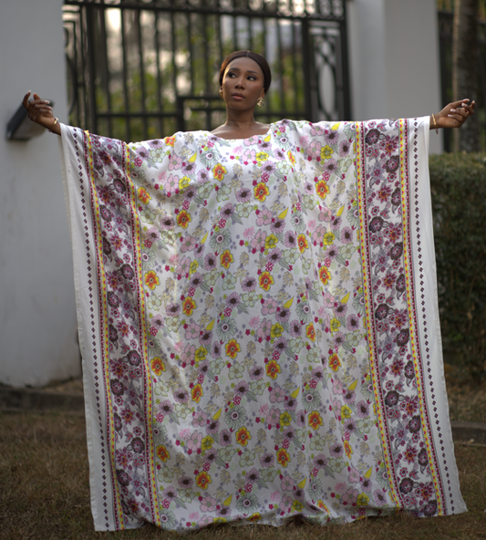 Woman wearing silk kaftan also known as bubu in african culture