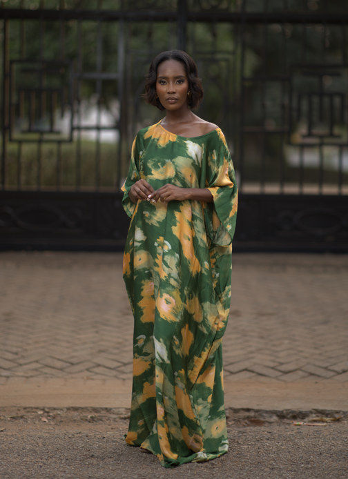 Woman wearing silk kaftan also known as bubu in african culture