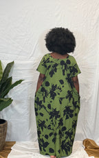 Black woman wearing bright colorful kaftan