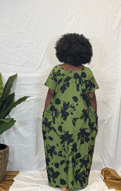 Black woman wearing bright colorful kaftan