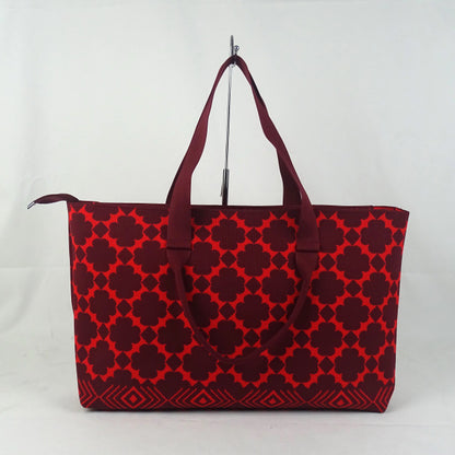 Red patterned tote bag on a white background