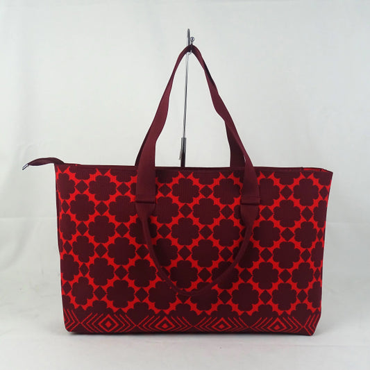 Red patterned tote bag on a white background