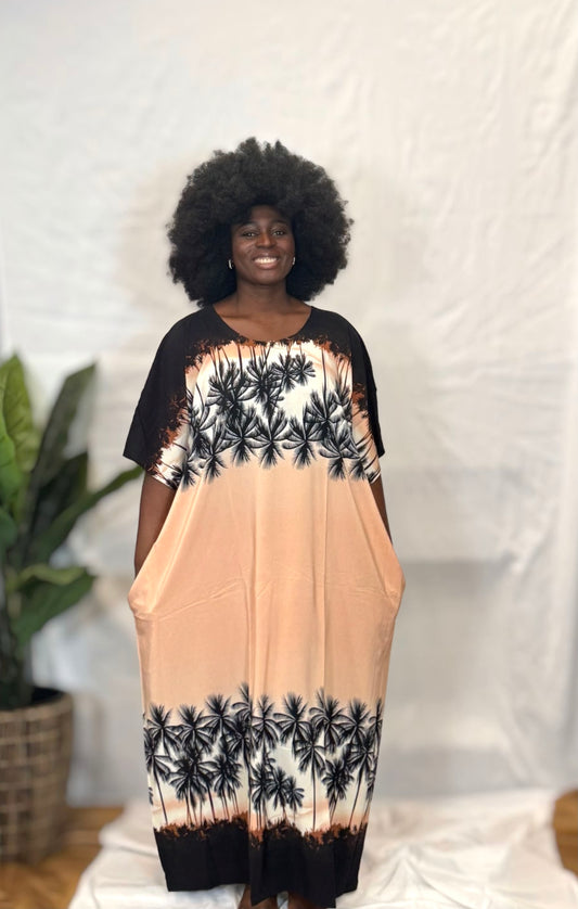 Black woman wearing bright colorful kaftan