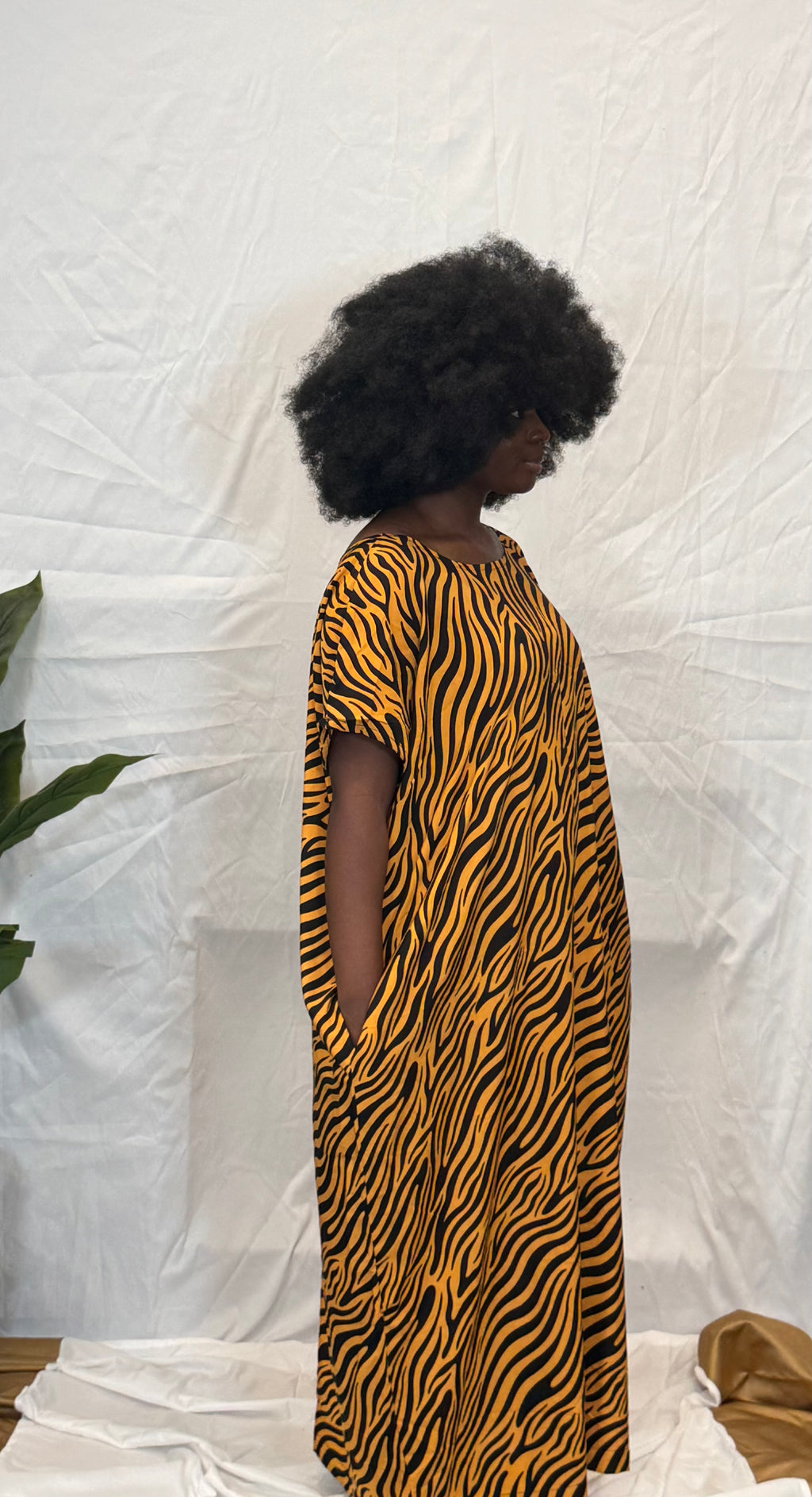 Black woman wearing colorful kaftan 