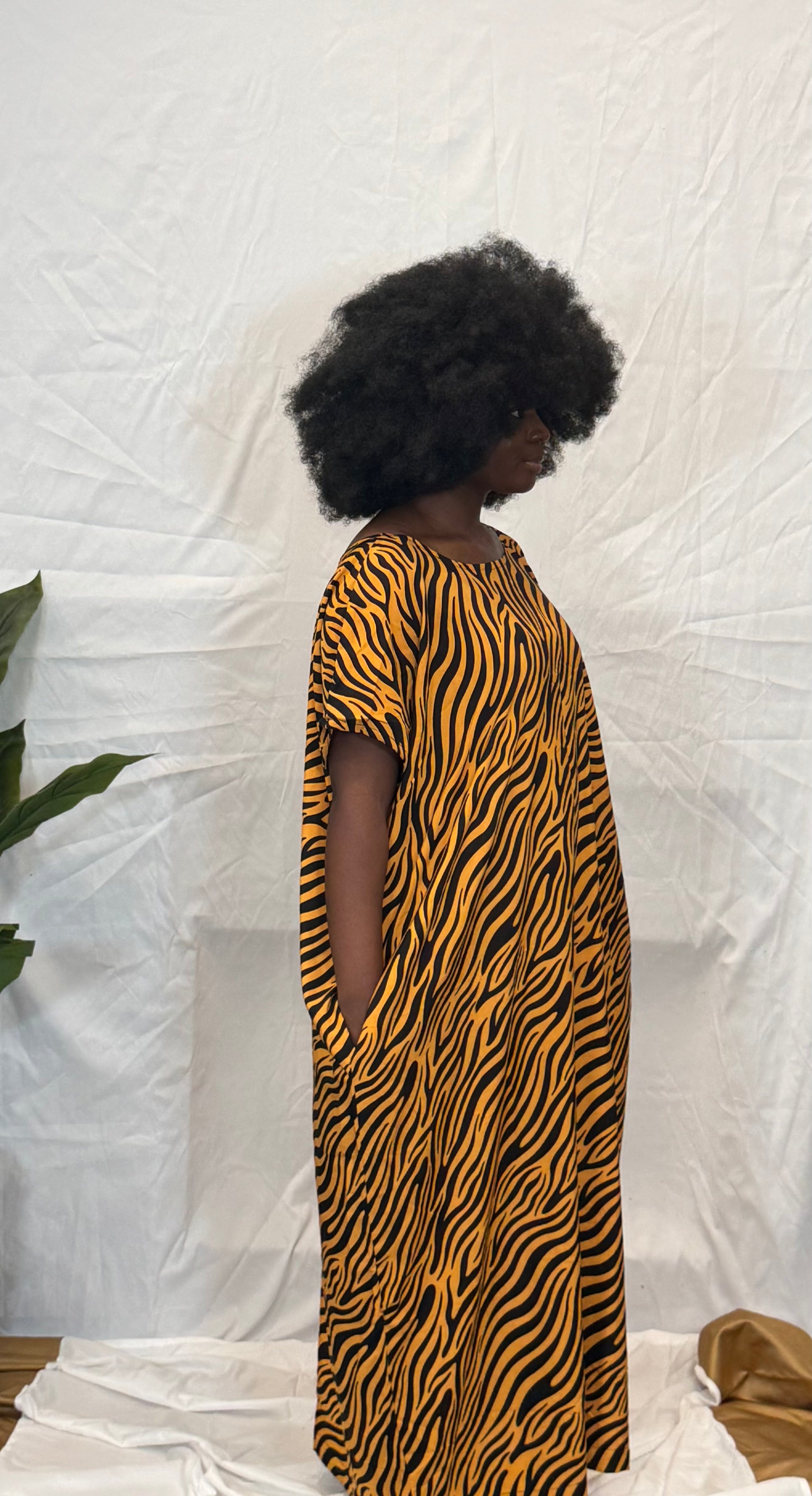 Black woman wearing colorful kaftan 