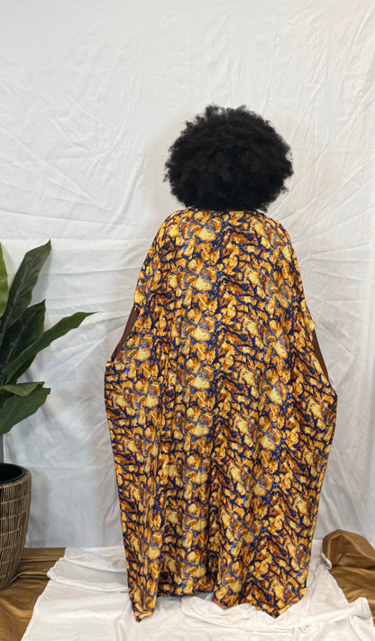 Black woman wearing bright colorful kaftan