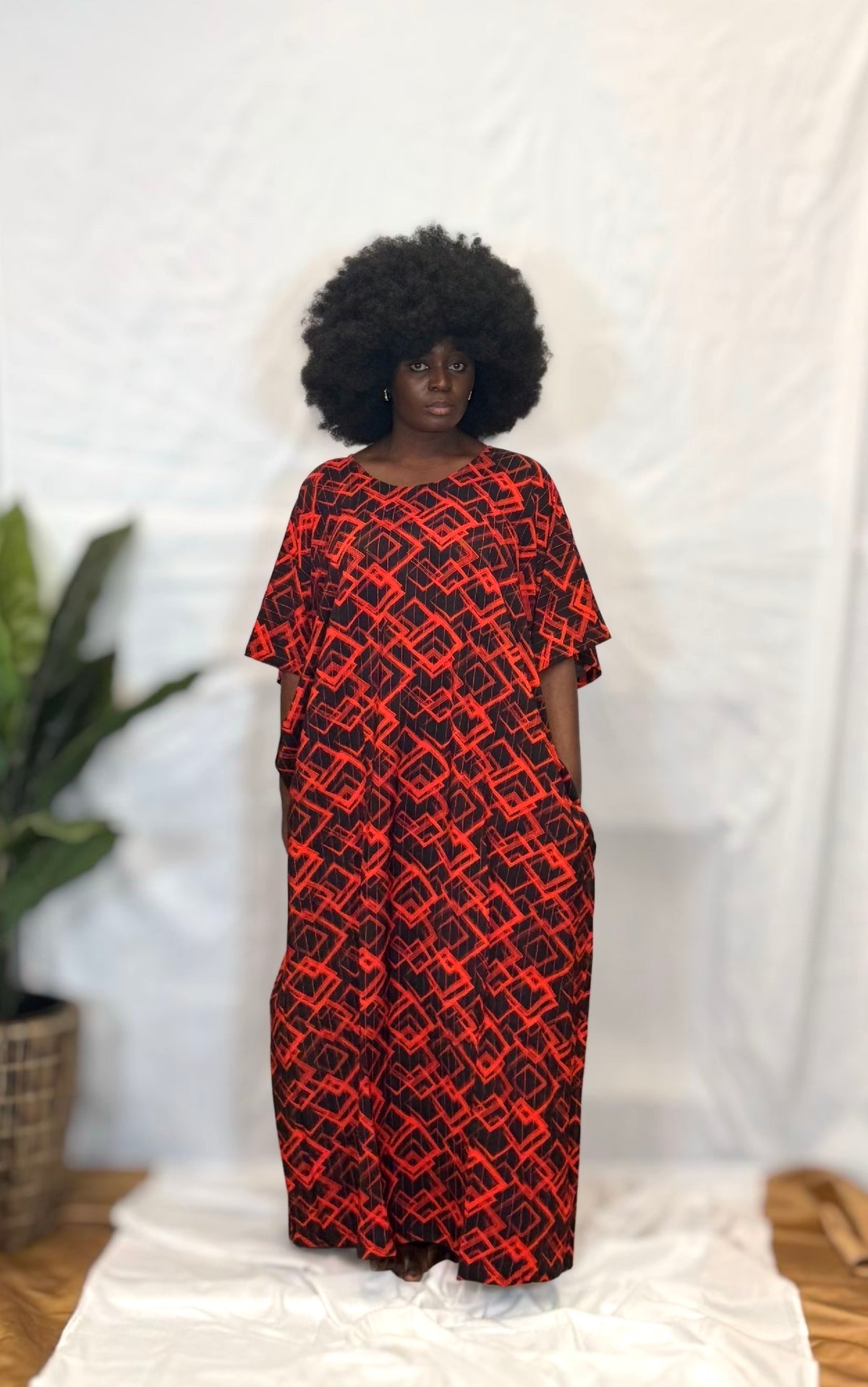 Black woman wearing bright colorful kaftan