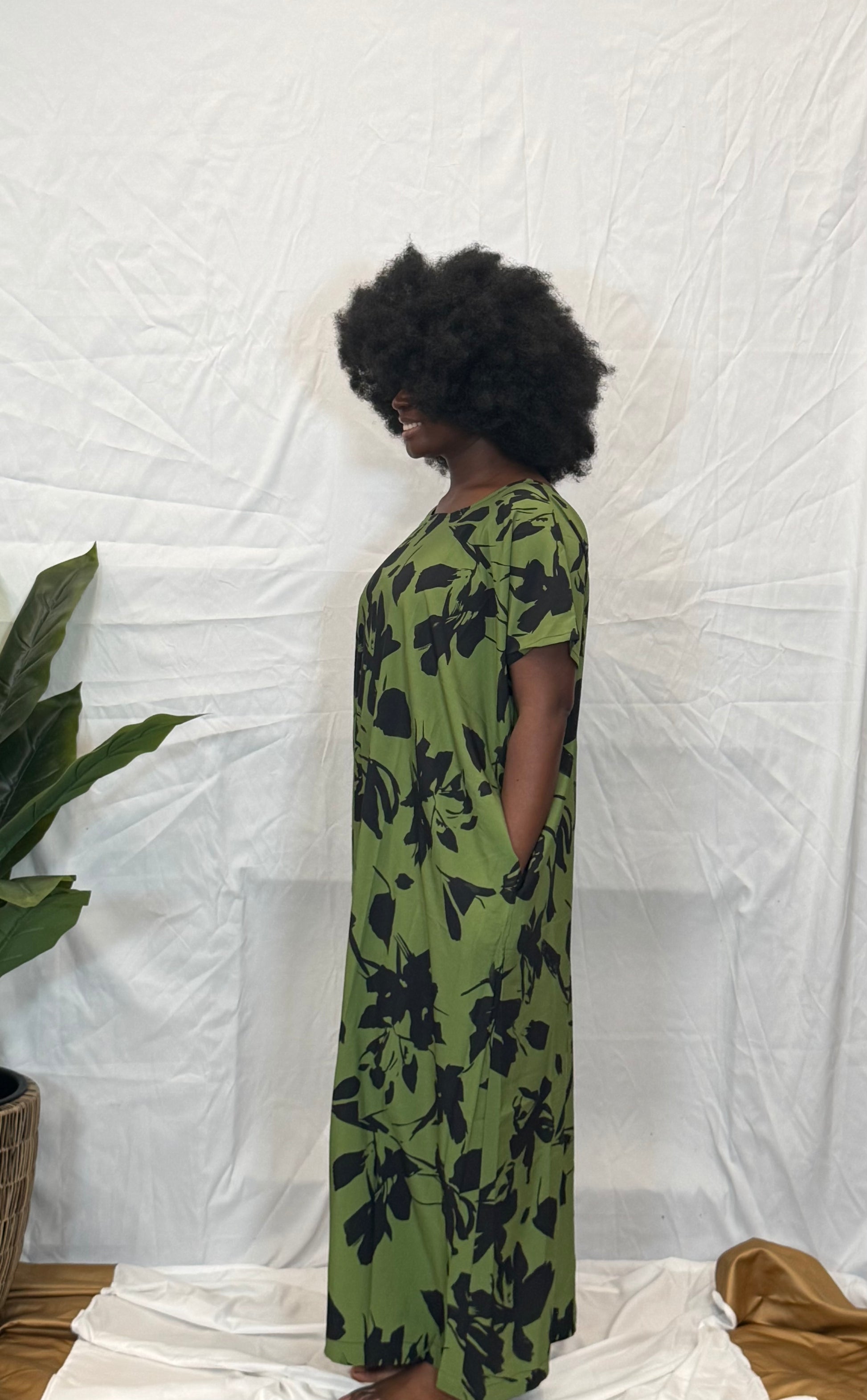 Black woman wearing bright colorful kaftan