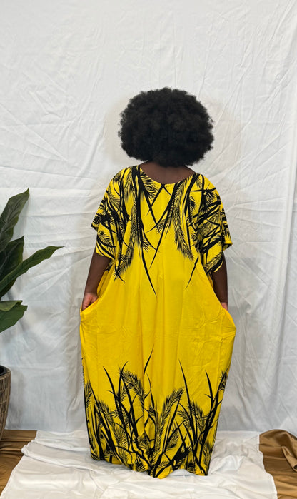 Black woman wearing bright colorful kaftan