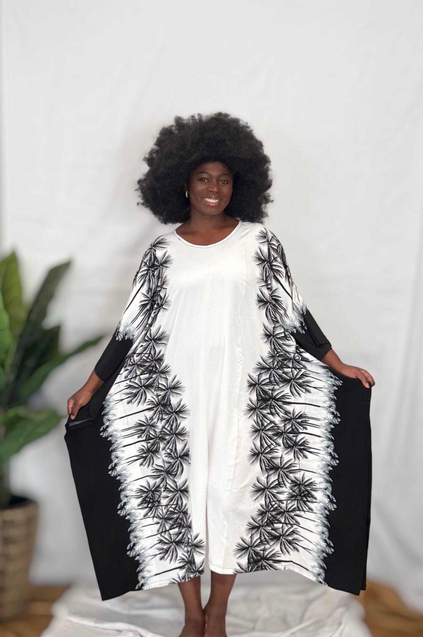Black woman wearing colorful kaftan