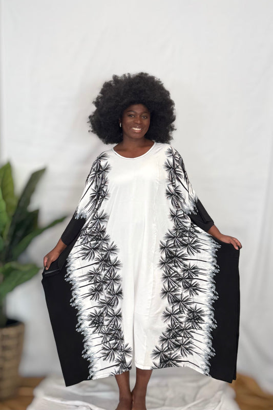 Black woman wearing colorful kaftan