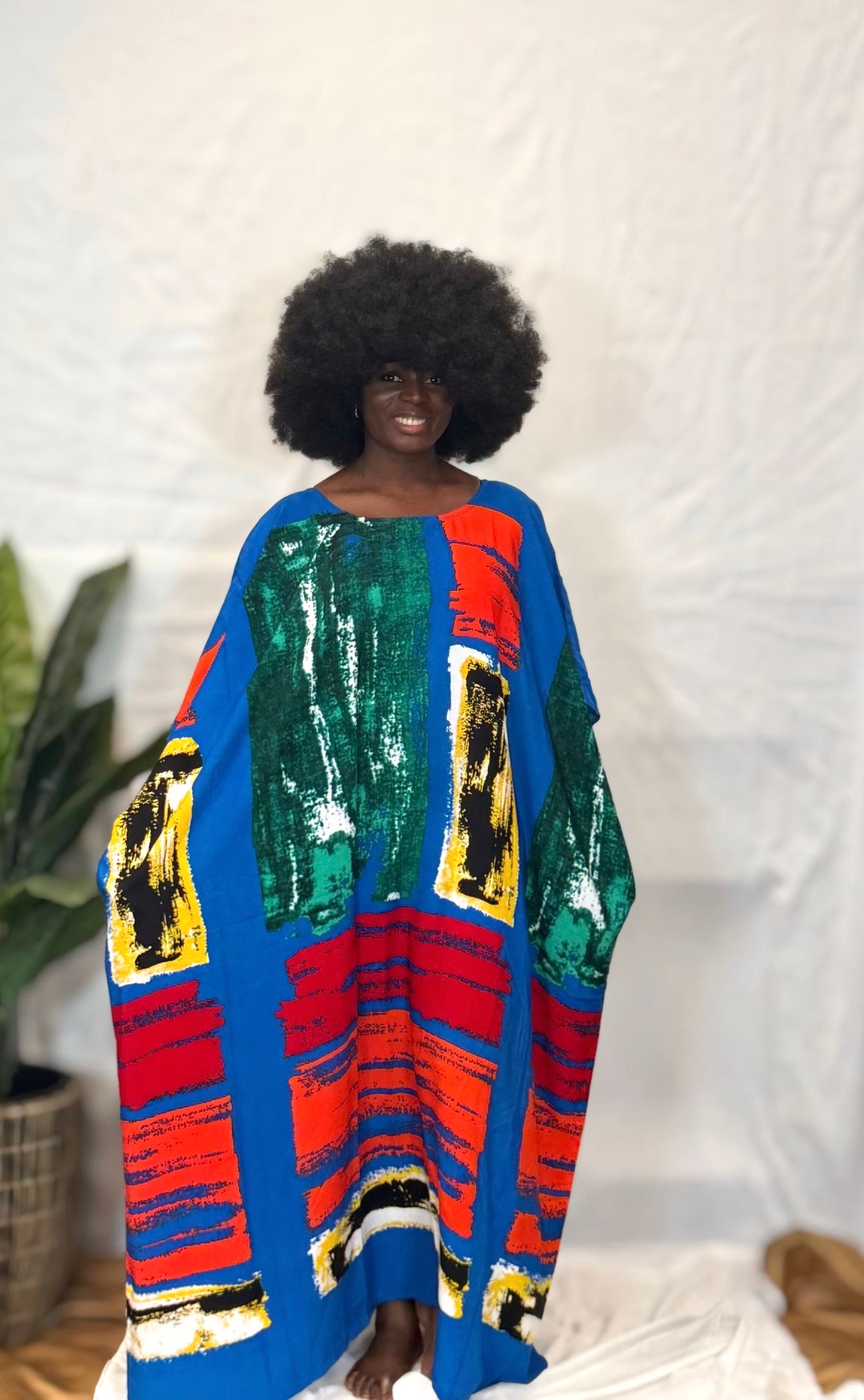 Black woman wearing colorful kaftan 