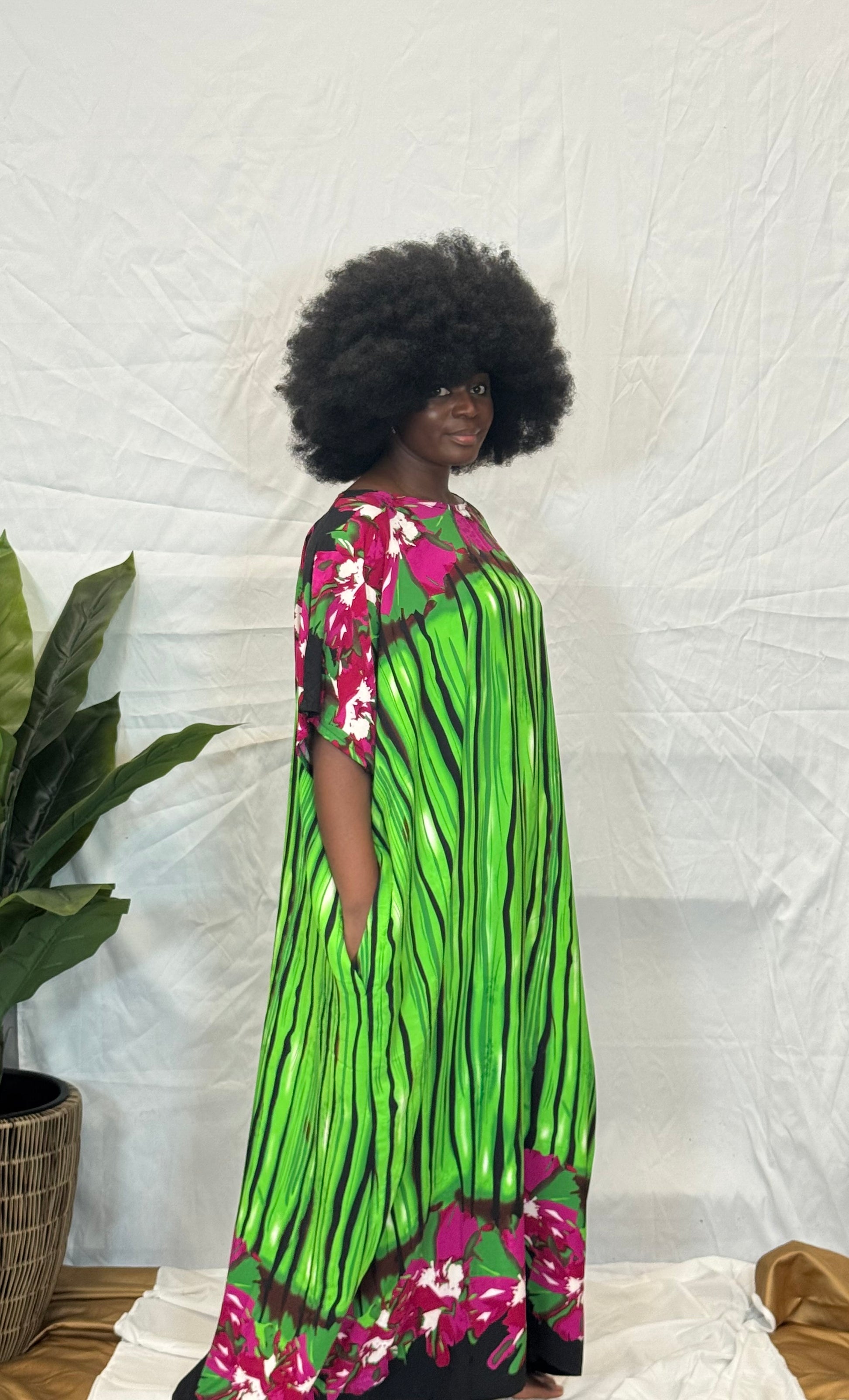 Black woman wearing bright colorful kaftan