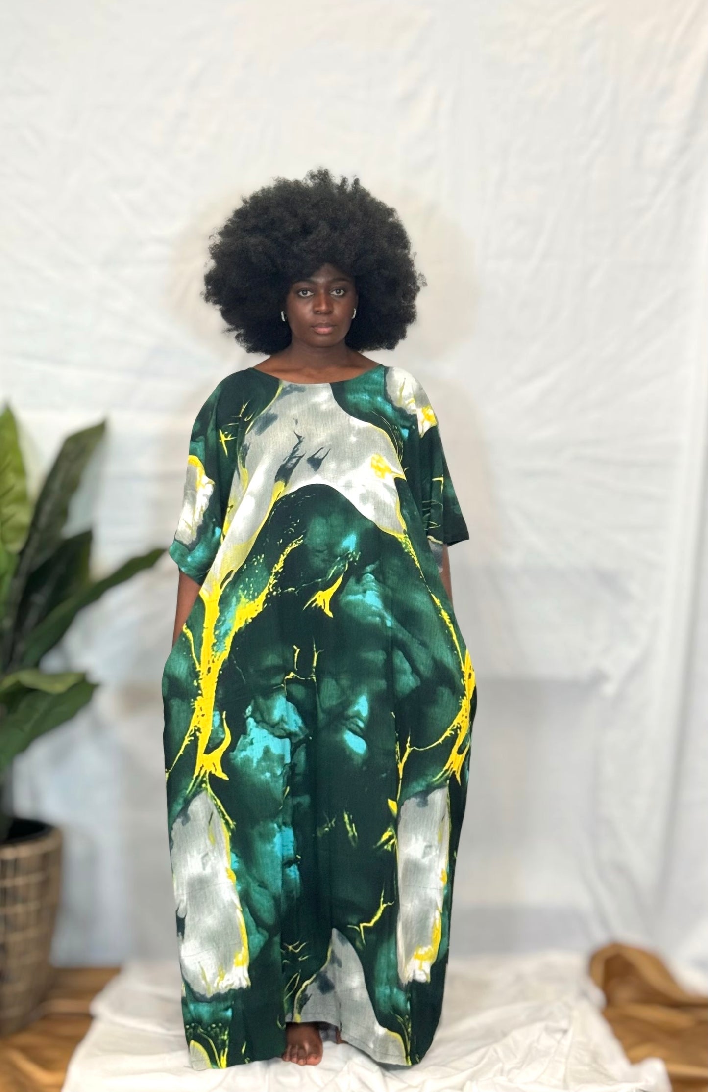 Black woman wearing bright colorful kaftan