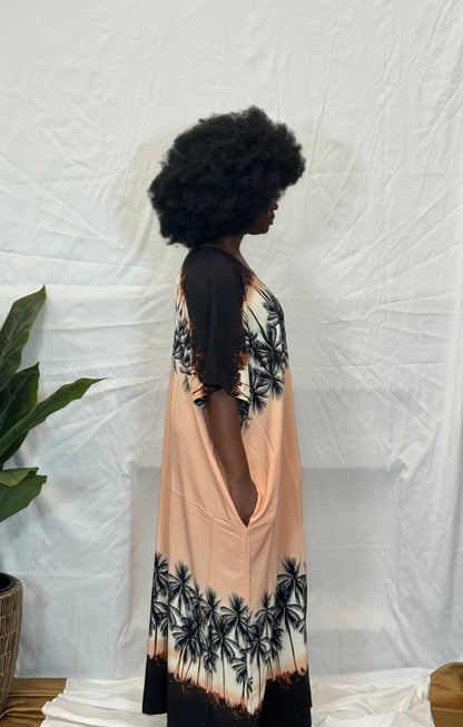 Black woman wearing bright colorful kaftan