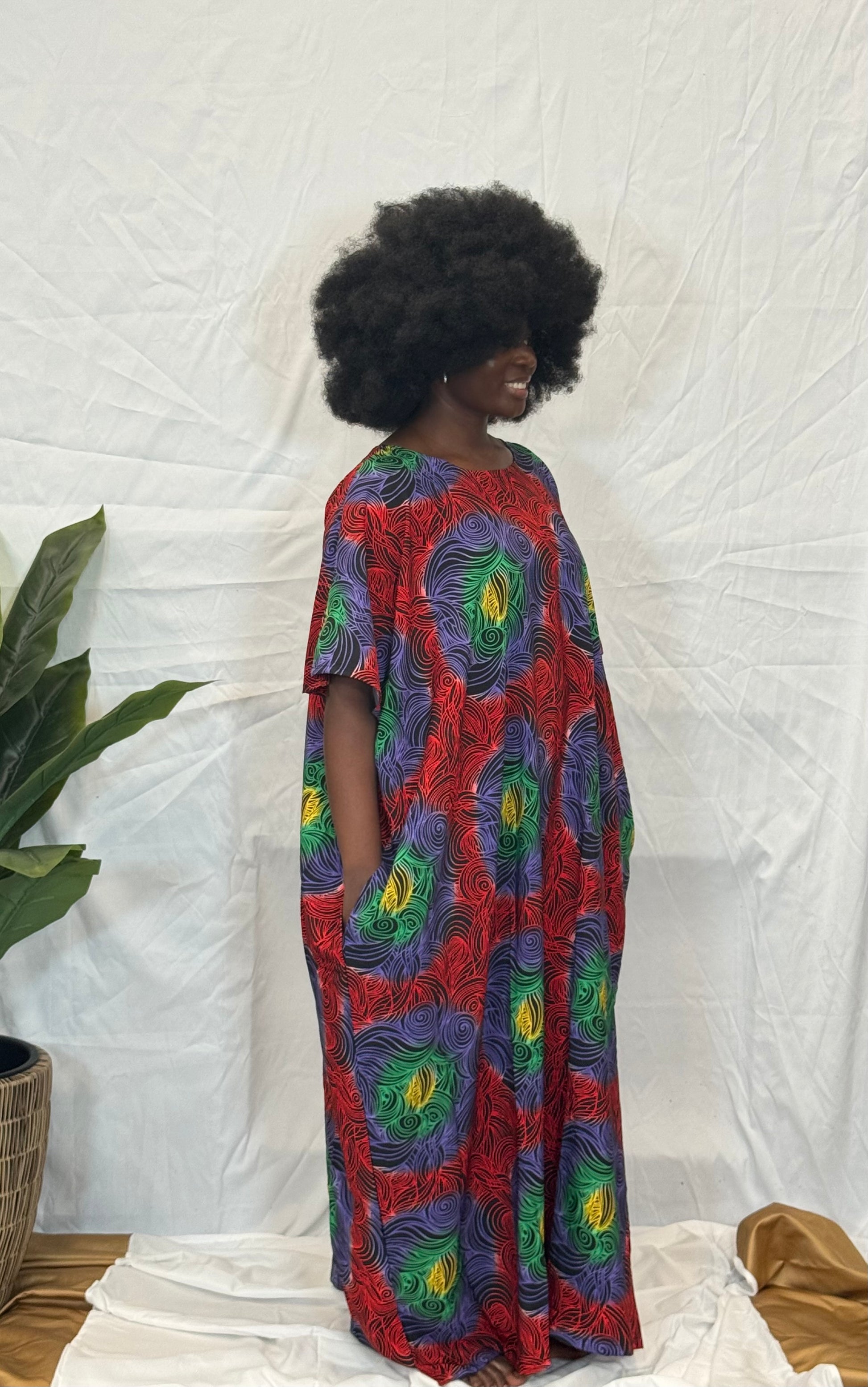 Black woman wearing bright colorful kaftan