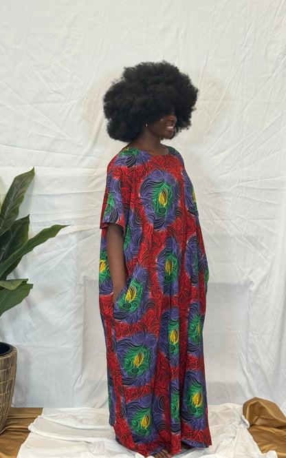 Black woman wearing bright colorful kaftan