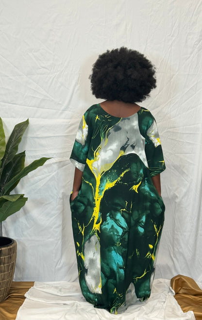 Black woman wearing bright colorful kaftan