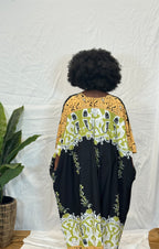 Black woman wearing colorful kaftan 