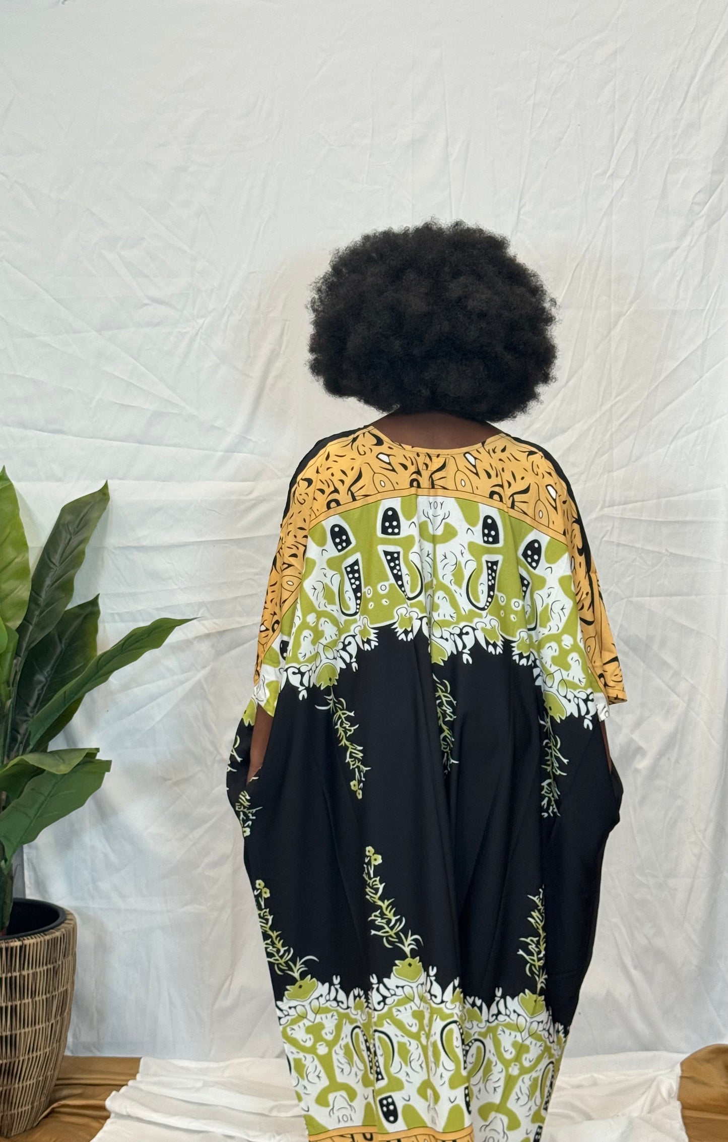 Black woman wearing colorful kaftan 