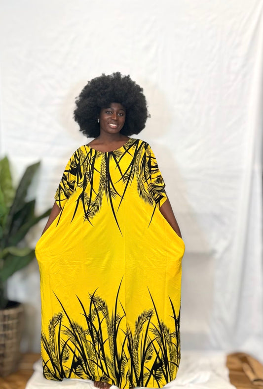 Black woman wearing bright colorful kaftan