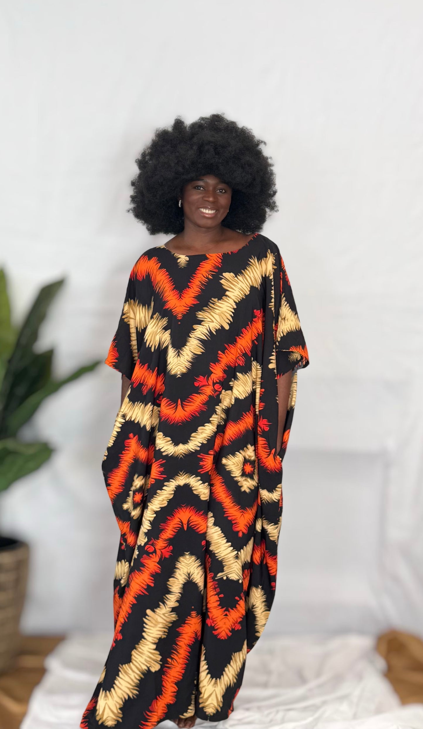 Black woman wearing colorful kaftan
