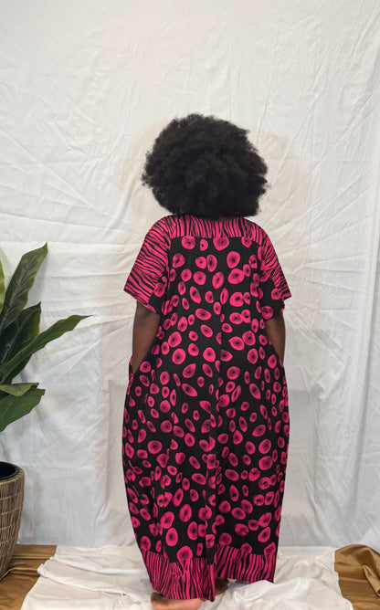 Black woman wearing bright colorful kaftan