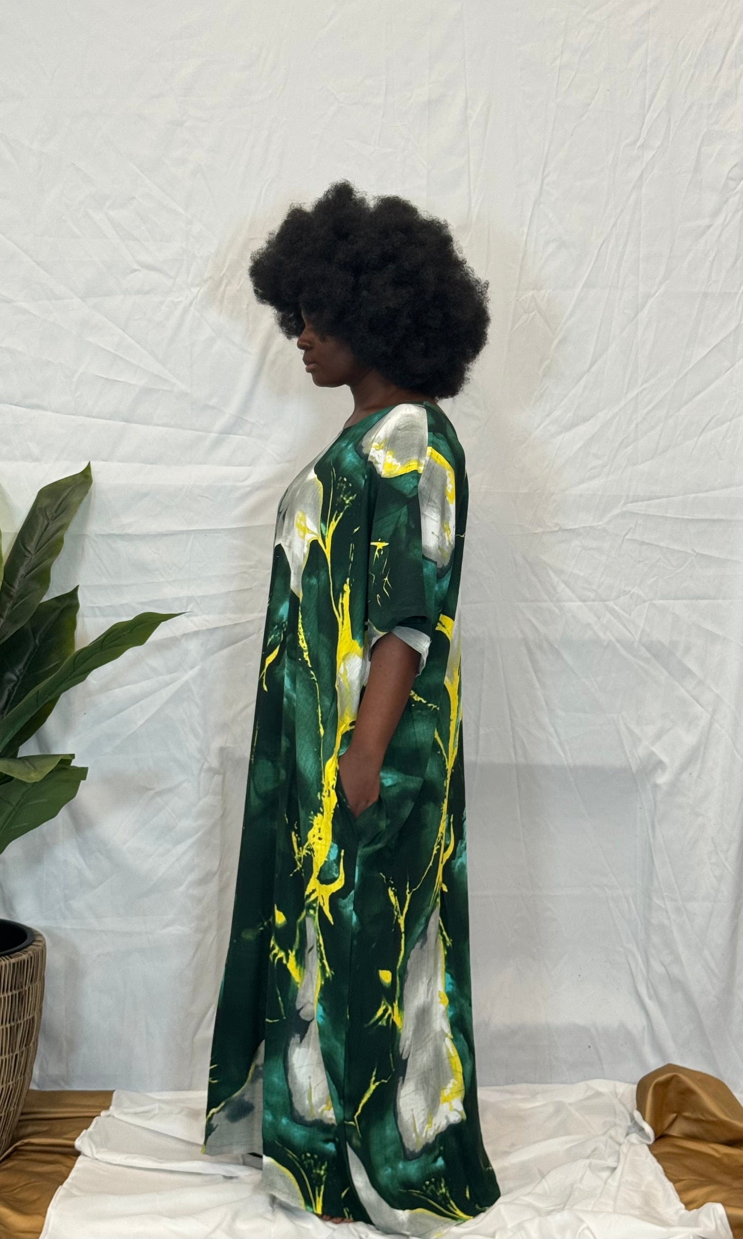 Black woman wearing bright colorful kaftan