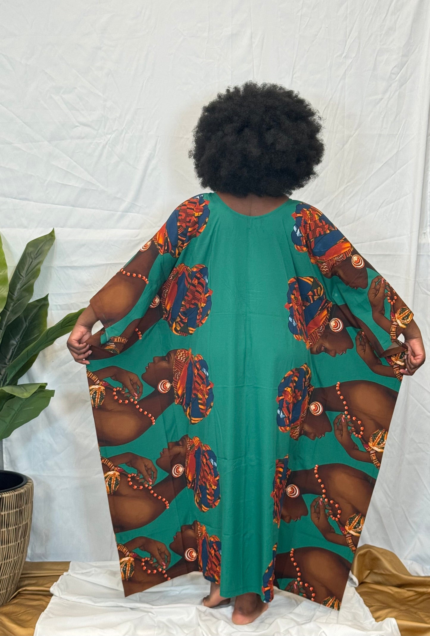 Black woman wearing bright colorful kaftan