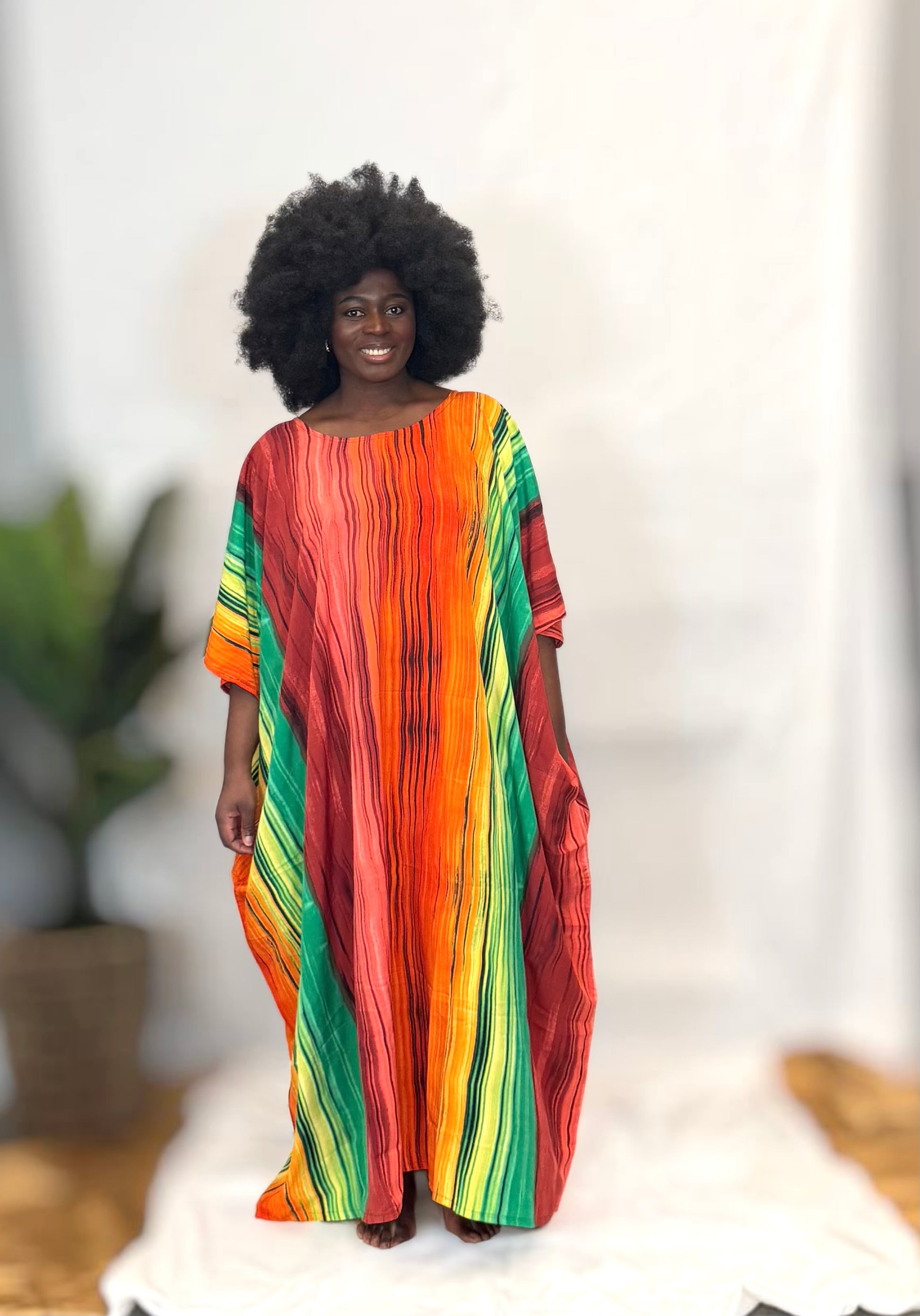 Black woman wearing colorful kaftan 