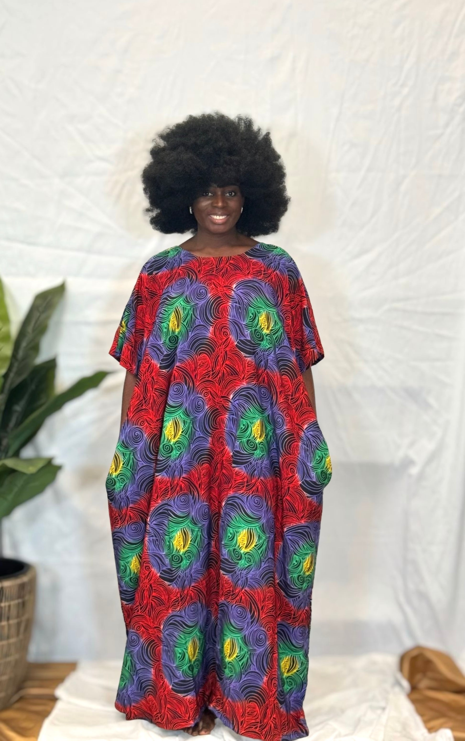 Black woman wearing bright colorful kaftan