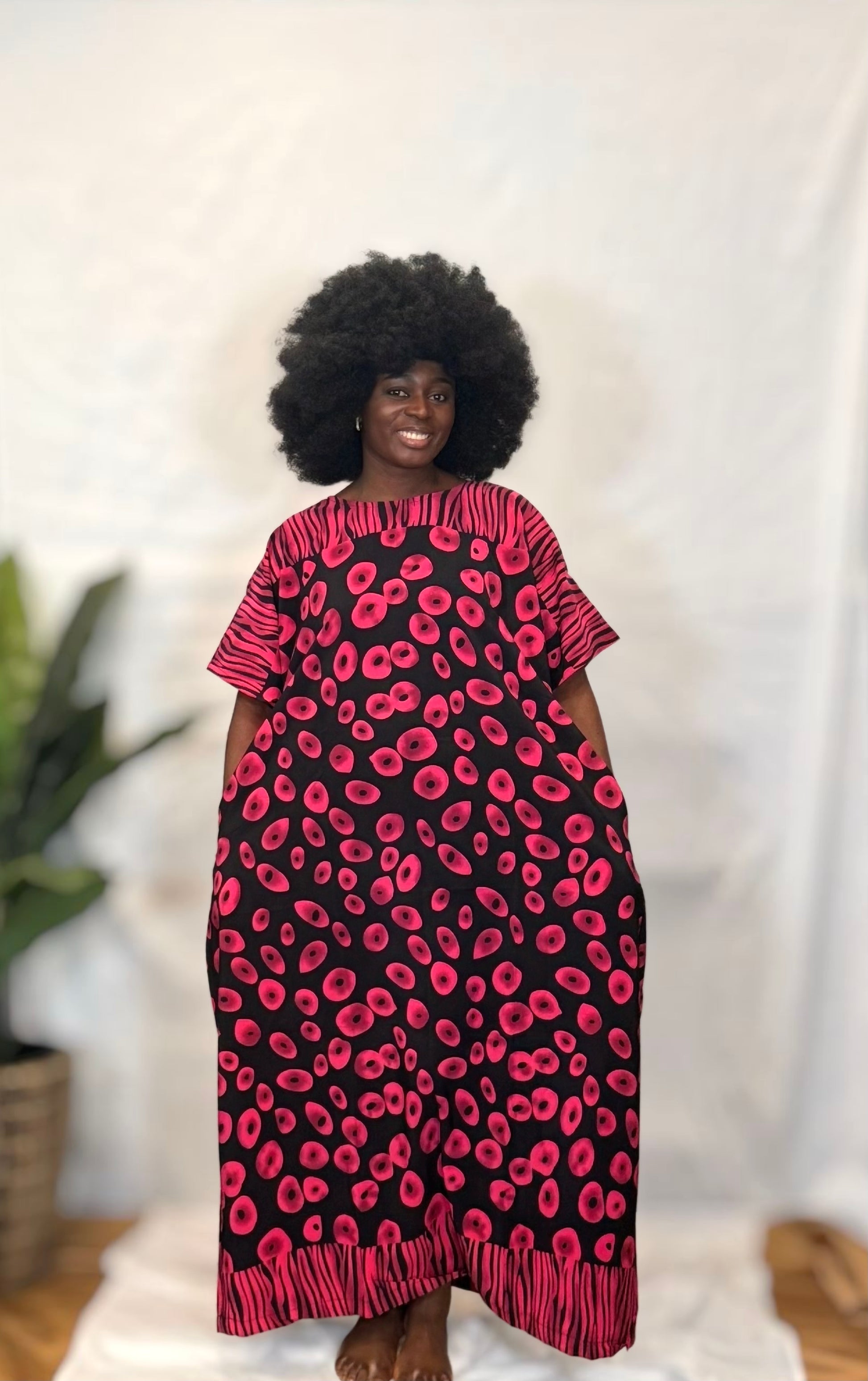 Black woman wearing bright colorful kaftan