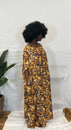 Black woman wearing bright colorful kaftan