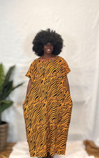 Black woman wearing colorful kaftan 