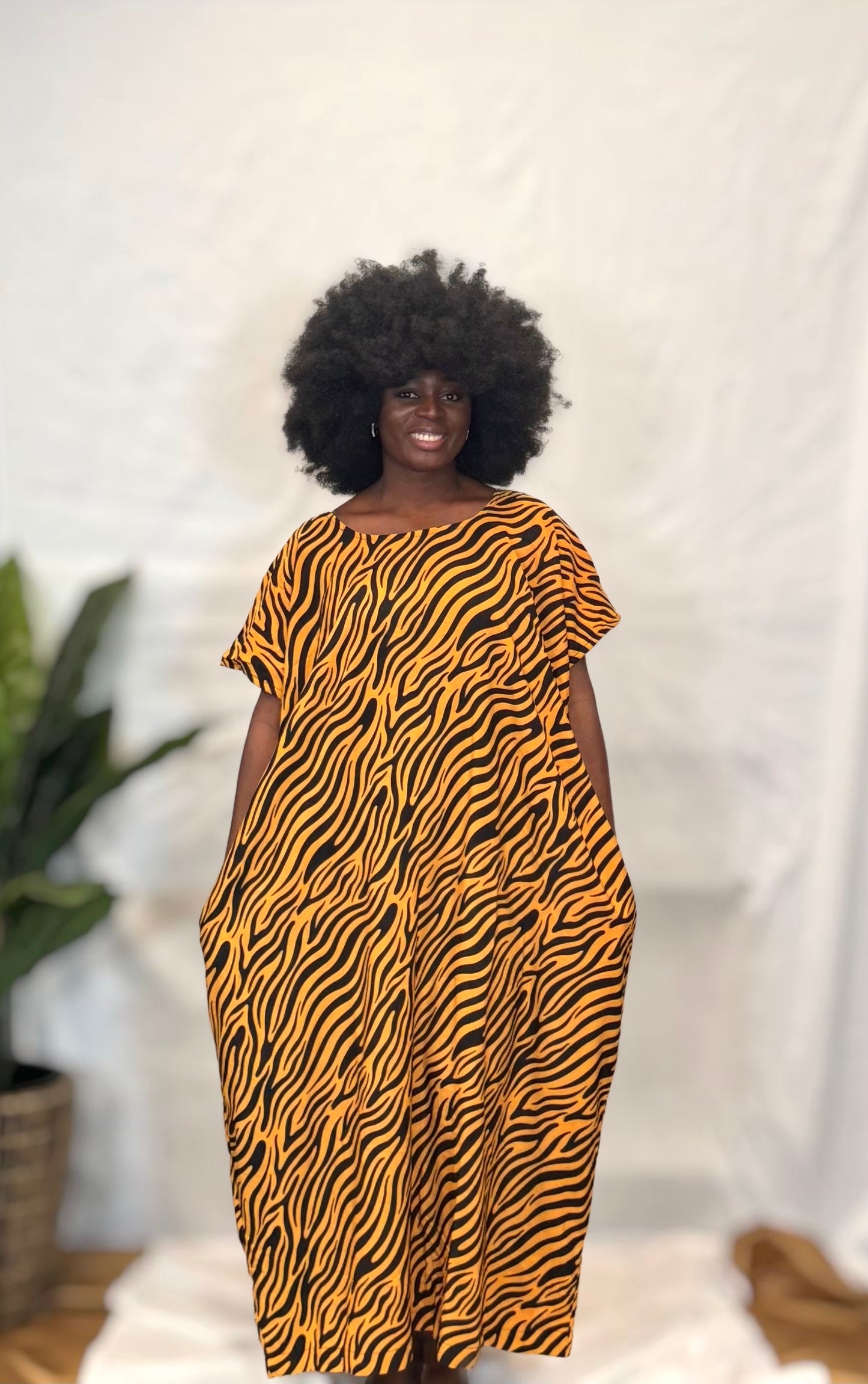 Black woman wearing colorful kaftan 