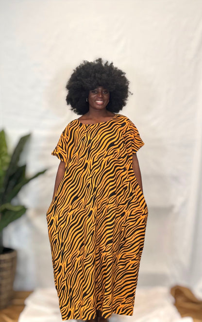 Black woman wearing colorful kaftan 