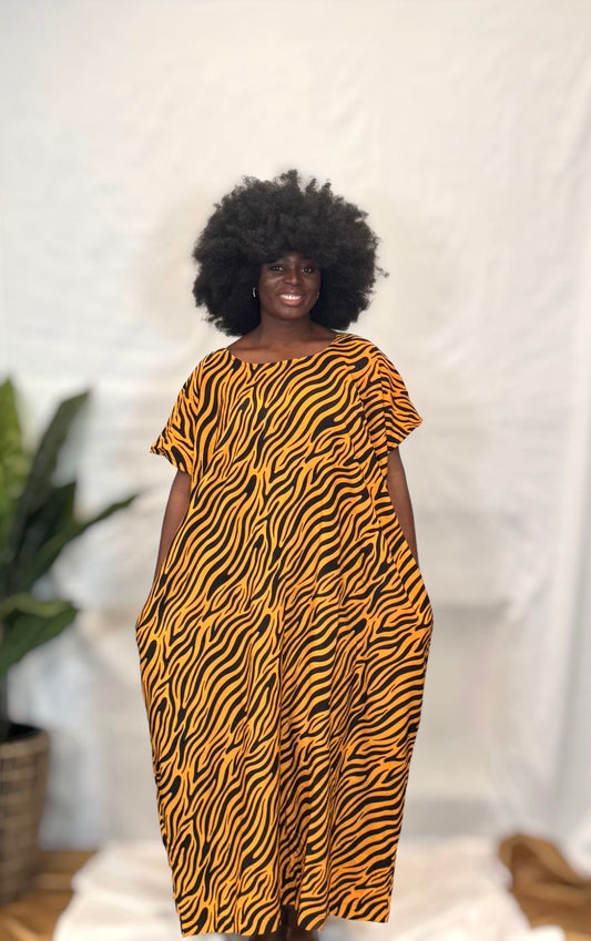 Black woman wearing colorful kaftan 