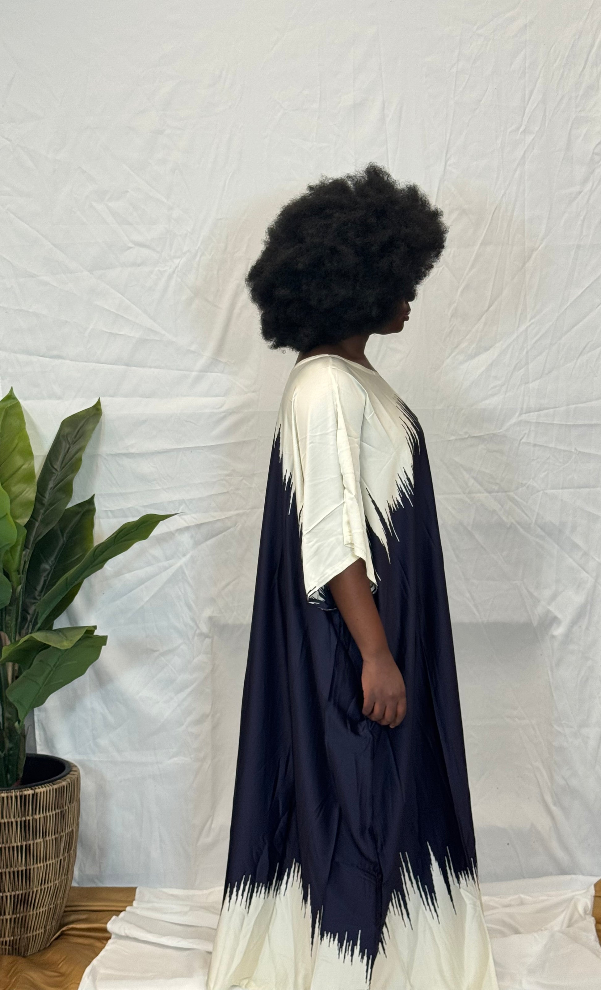 Black woman wearing bright colorful kaftan