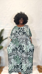 Black woman wearing bright colorful kaftan