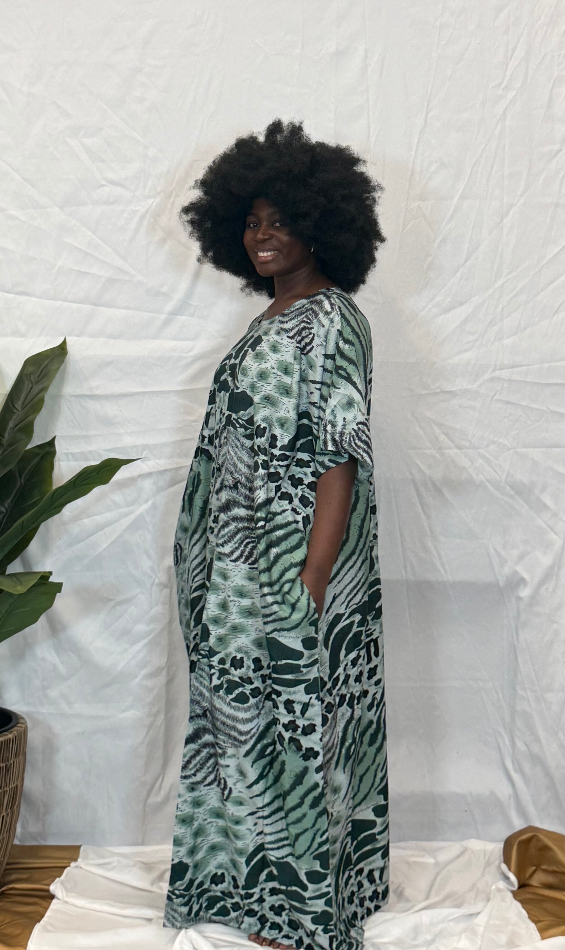 Black woman wearing bright colorful kaftan