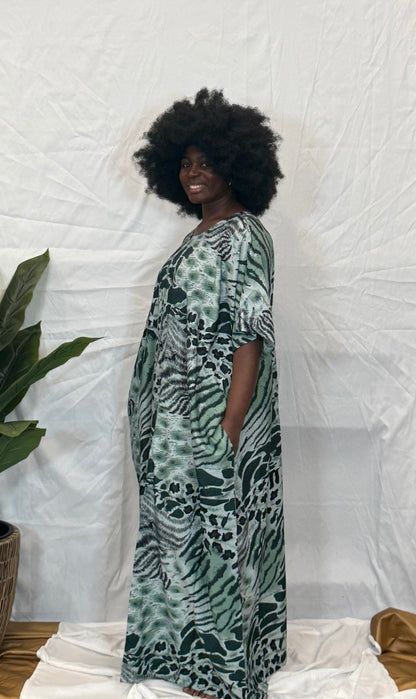 Black woman wearing bright colorful kaftan